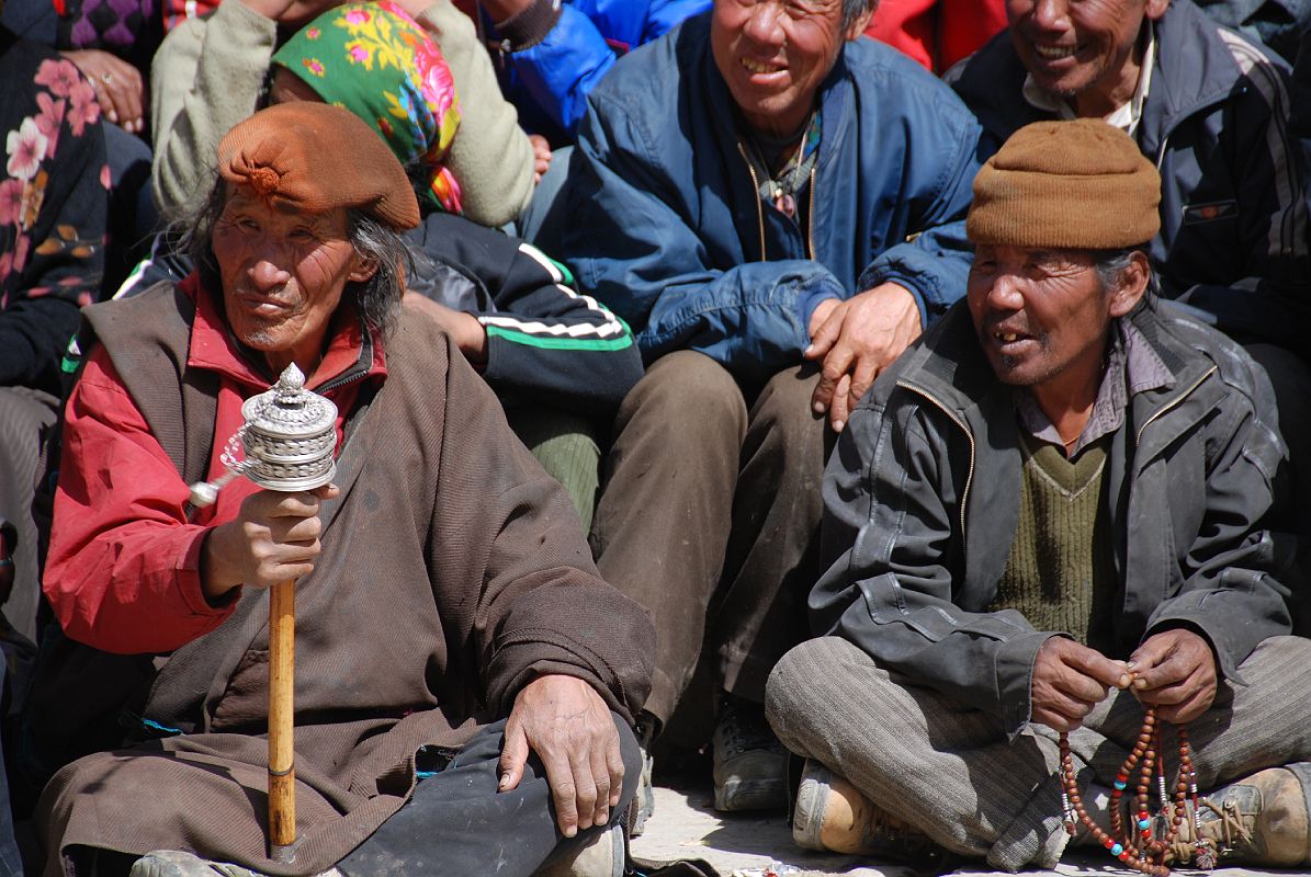 Mustang Lo Manthang Tiji Festival Day 3 04-1 Men Twirling Prayer Wheels and Counting Mantras On Beads